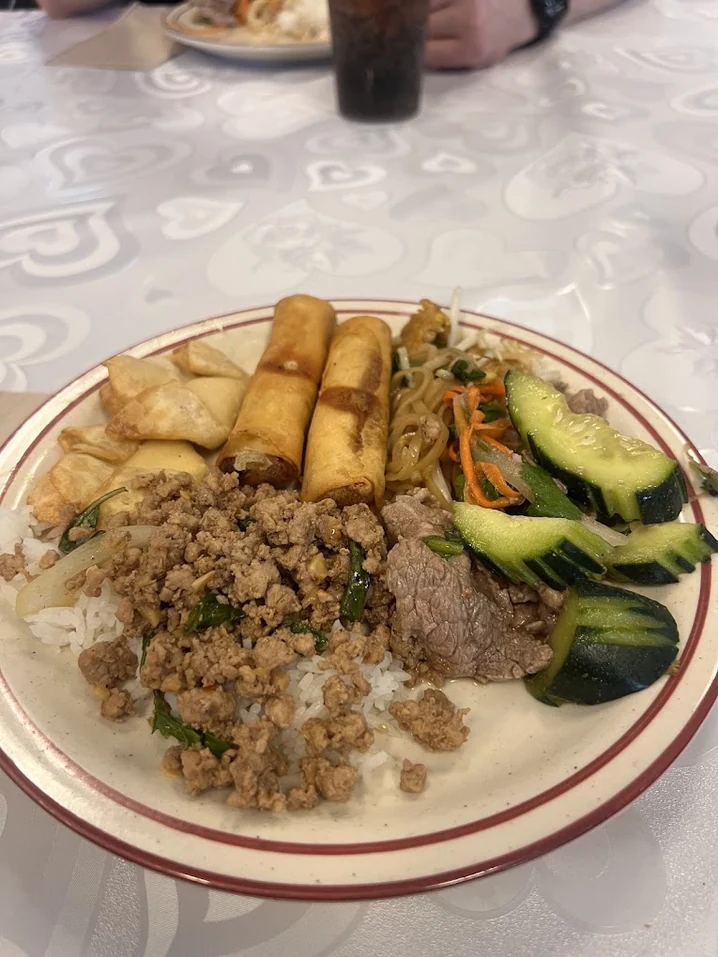 Basil pork over jasmine rice with spring rolls