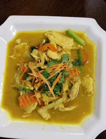 Yellow curry with chicken and carrots